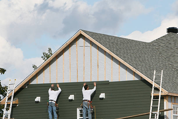 Professional Vinyl Siding technician working in Roosevelt, NY